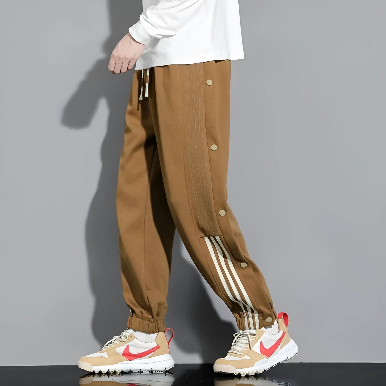 Men's loose grey ankle-tied sports sweatpants with drawstring waist
