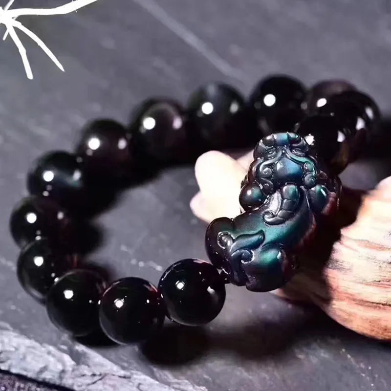 Natural ice colour eye obsidian crystal bracelet with round beads on wrist