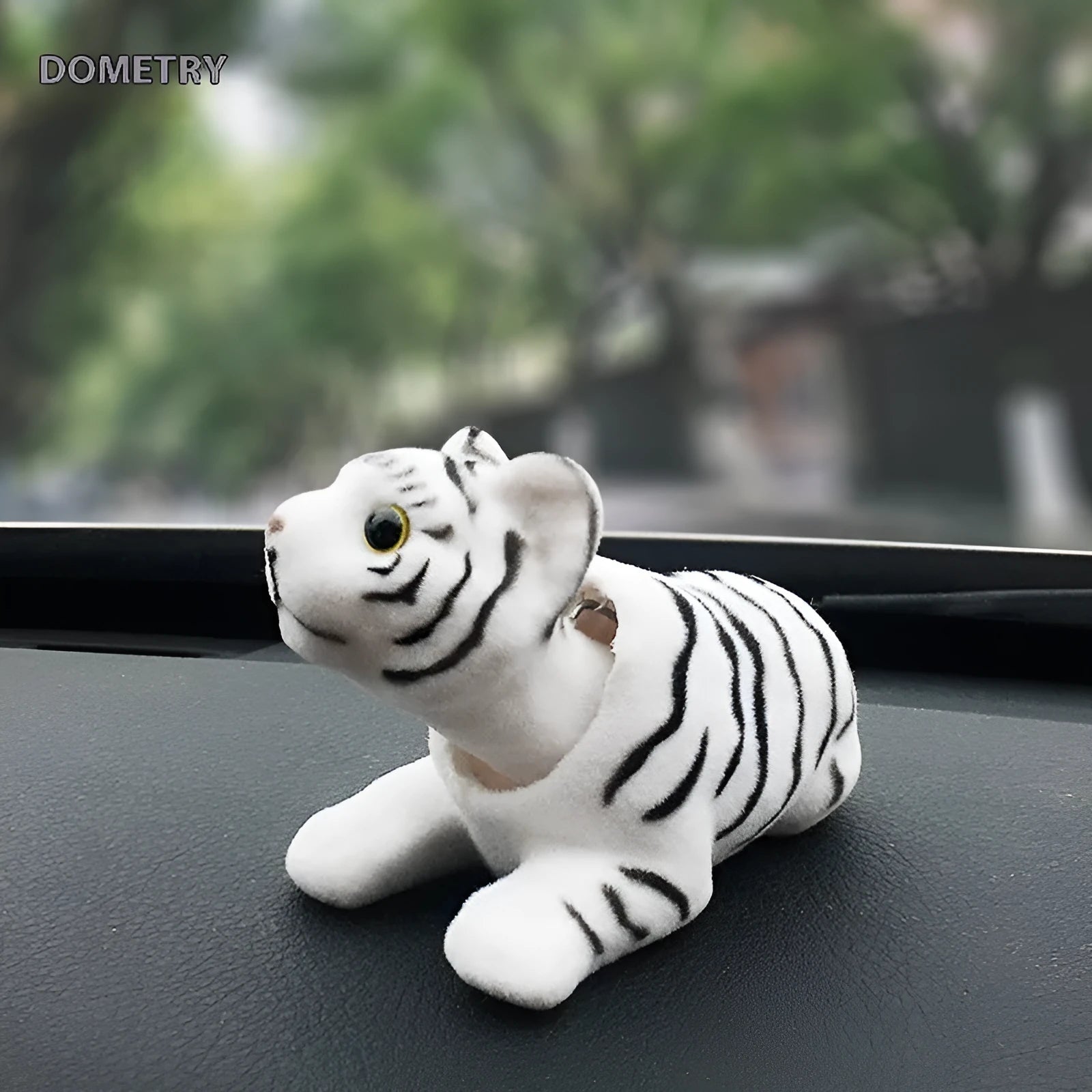 Resin head-shaking dog car decoration in multiple breed colour options on a car dashboard