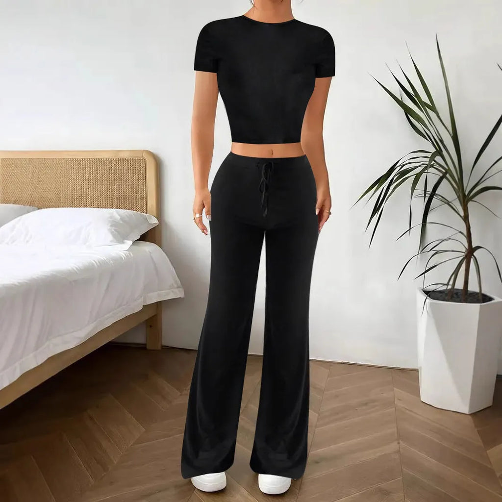 Women's black high-waist trouser and short-sleeve t-shirt suit set on hanger