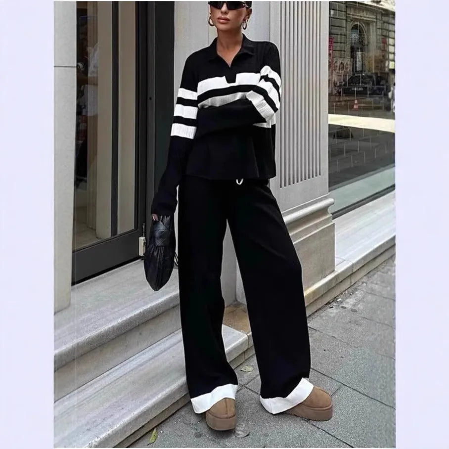 Women's black and white striped two-piece set with polo collar shirt and trousers