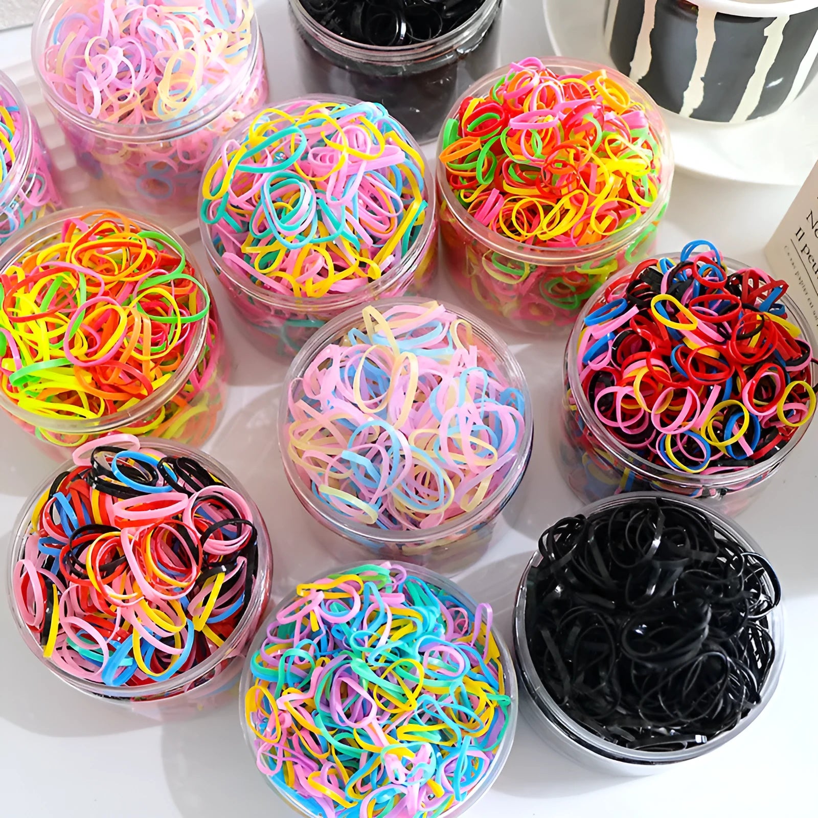 Multi-colour TPU baby hair ties in a reusable container, 300 or 600 pack for toddlers and girls with thin hair