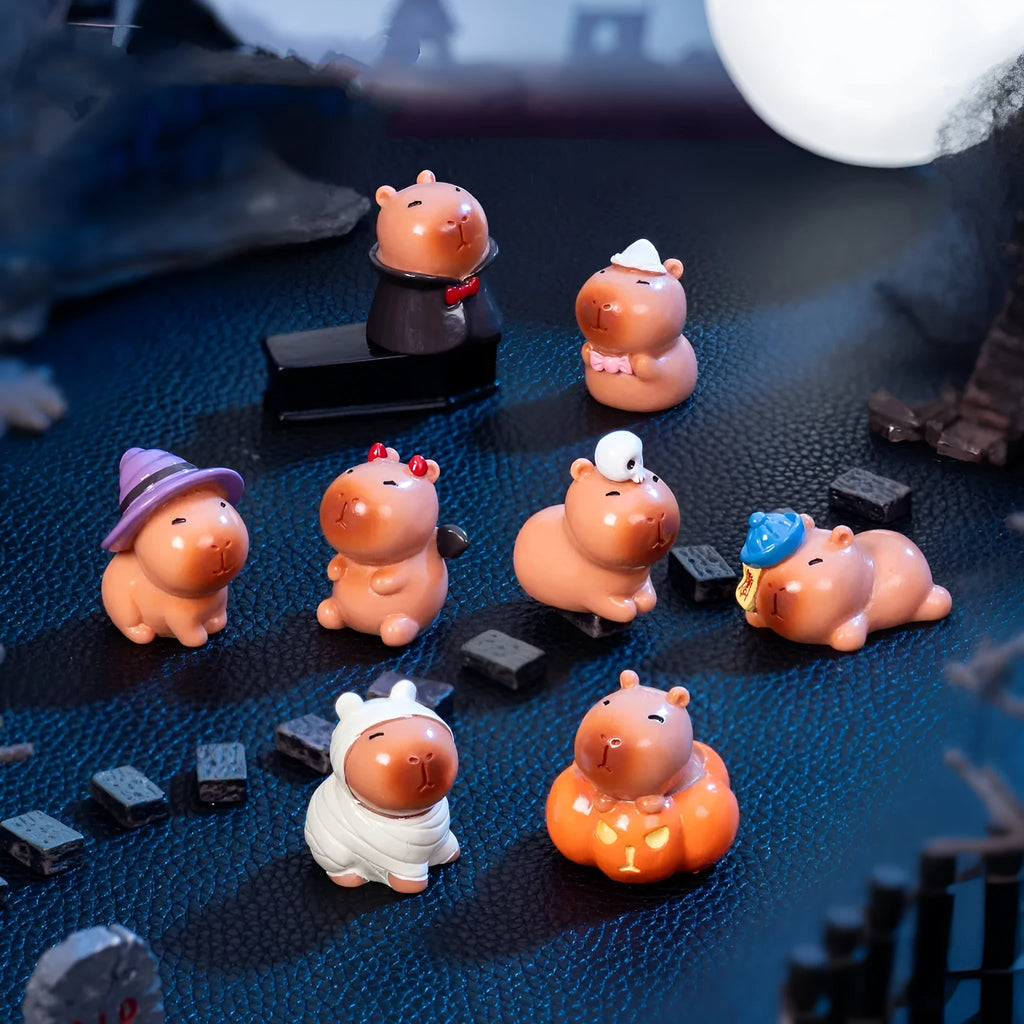 Set of eight micro capybara resin Halloween decorations in Pumpkin, Zombie, Ghost, Mummy, Vampire, Witch Hat, Little Devil, and Skull colours