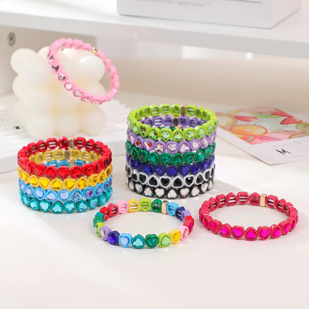 Rainbow enamel alloy heart stretch bracelet in TCSL003 colour variant on a white background