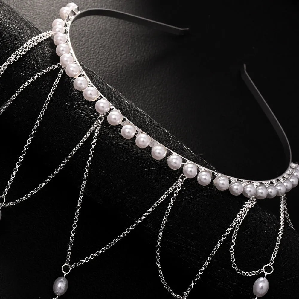 Women's electroplated hair chain with pearl decoration and tassel detailing in gold and silver options