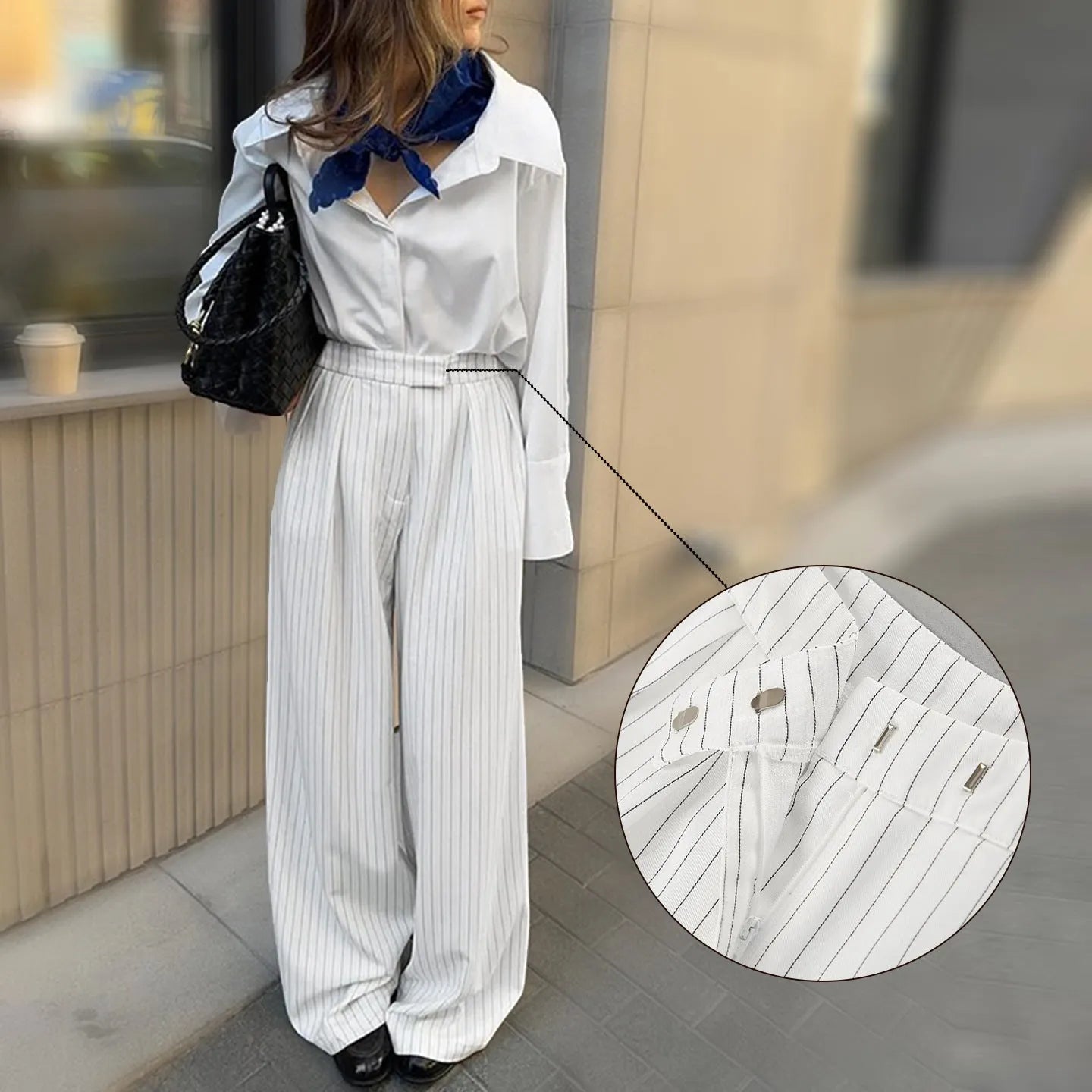 White striped wide-leg casual trousers with zipper closure on mannequin