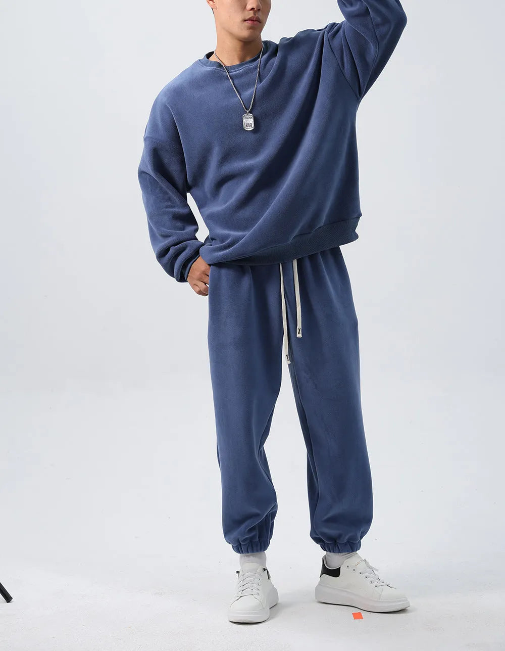 Men's loose fit polar fleece sports suit in winter colours, showing coat and trousers.