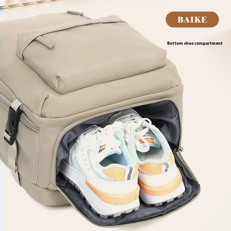 Large grey waterproof Oxford cloth travel backpack with curved shoulder straps shown front view.