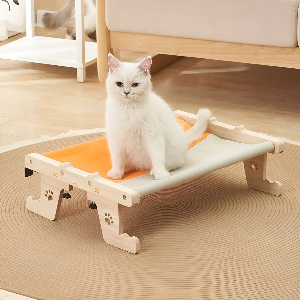 Wooden frame cat hanging bed with patterned removable cushion mounted on window