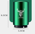 Automatic stainless steel beer bottle opener with magnetic cap catch on a table