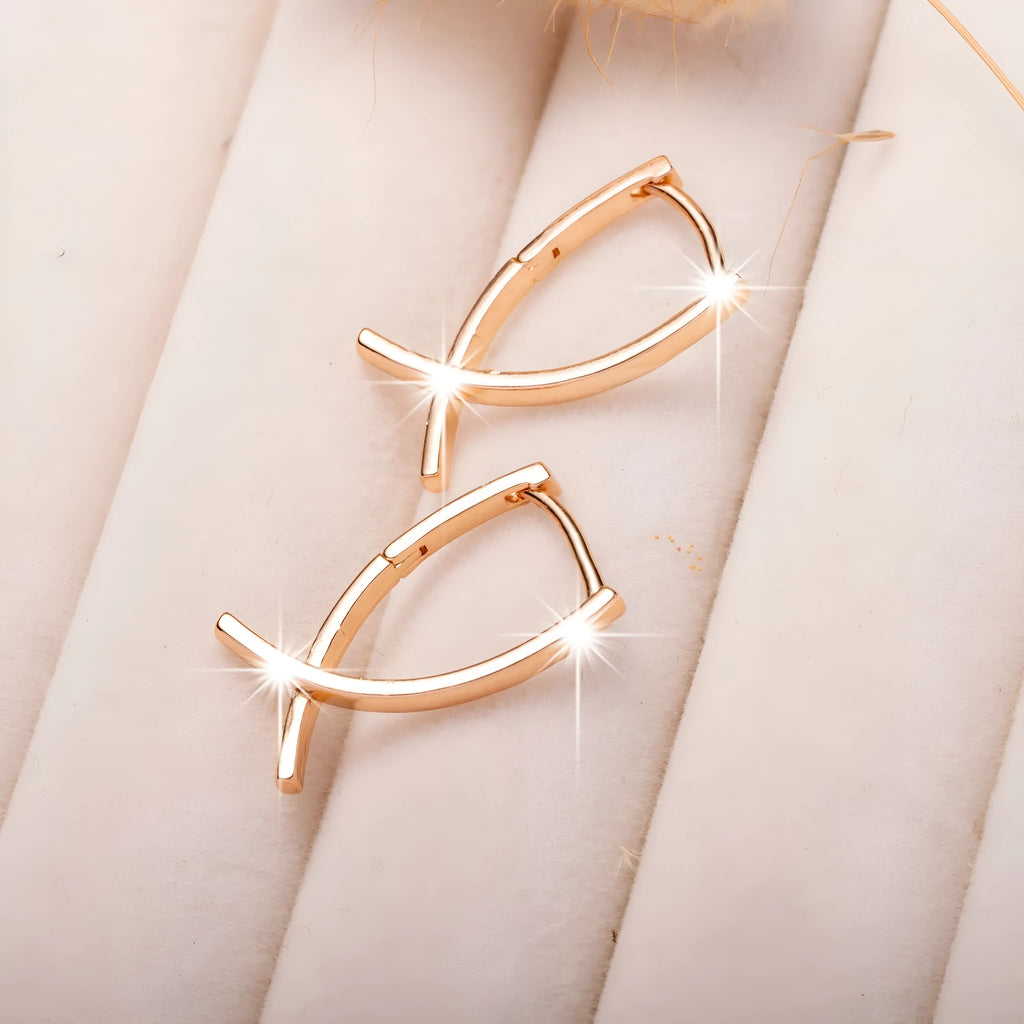 Rose gold plated copper cross earrings with symmetrical design and post fittings
