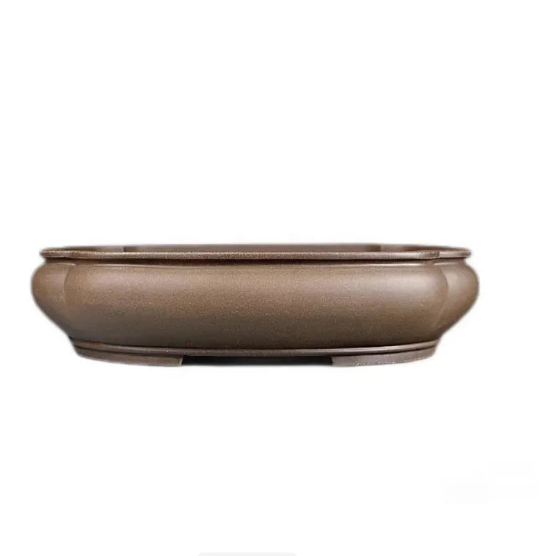 Handmade antique papaya-shaped purple clay flower pot for plants.