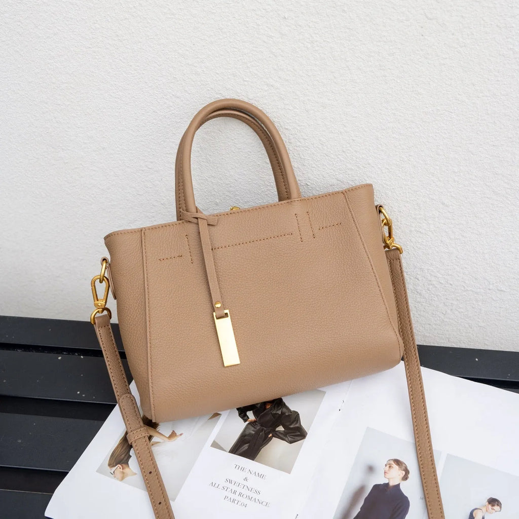 Portable genuine leather women handbag in soft cowhide with horizontal square shape and single strap, available in multiple colours