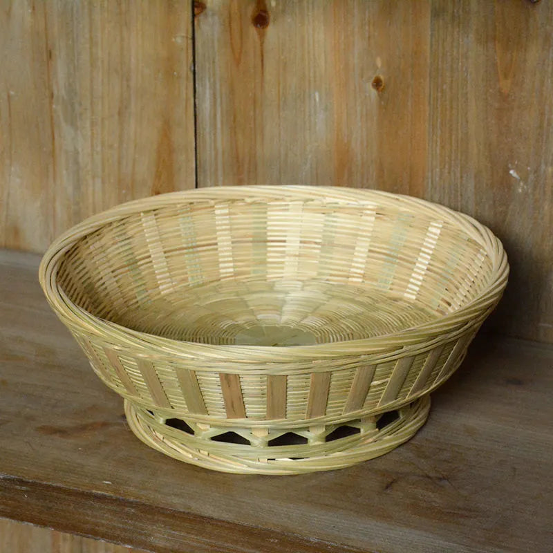 Handmade natural bamboo storage basket shown in one of three available sizes.