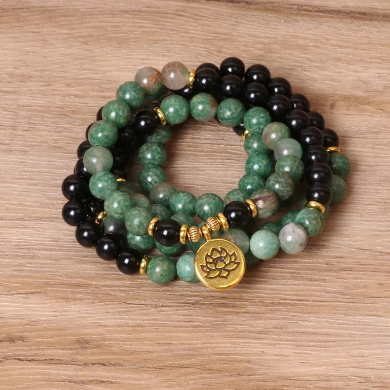Green and black elastic beaded alloy bracelet with stretch design on wrist
