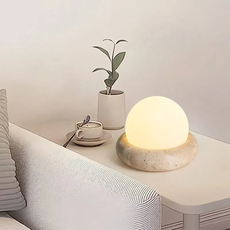 Cream modern bedside night lamp with remote control on wooden nightstand
