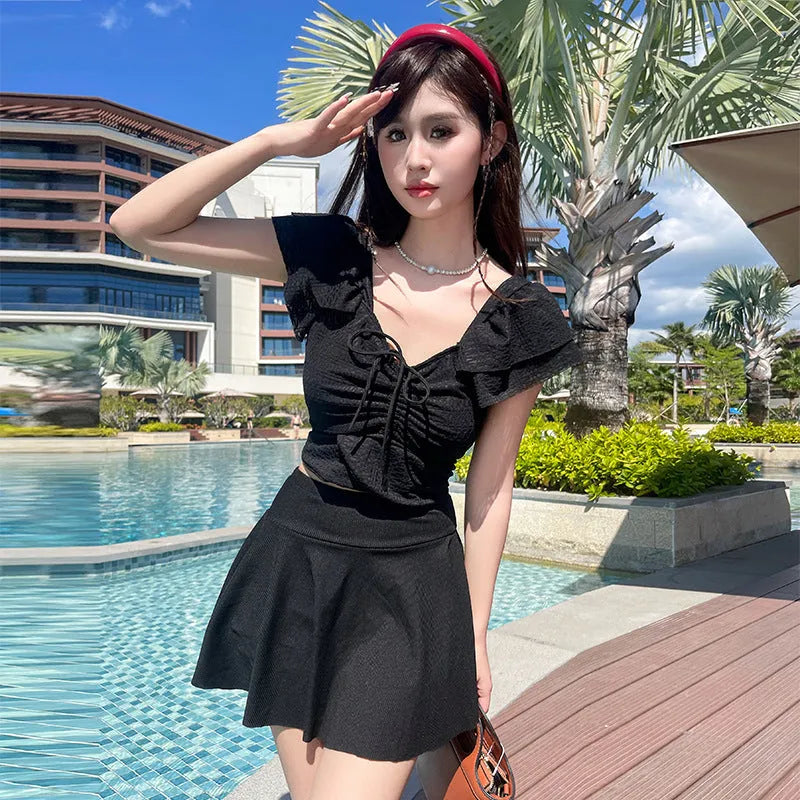 Women's split skirt-style bathing swimsuit in polyester and spandex, black colour, with top and separate skirt