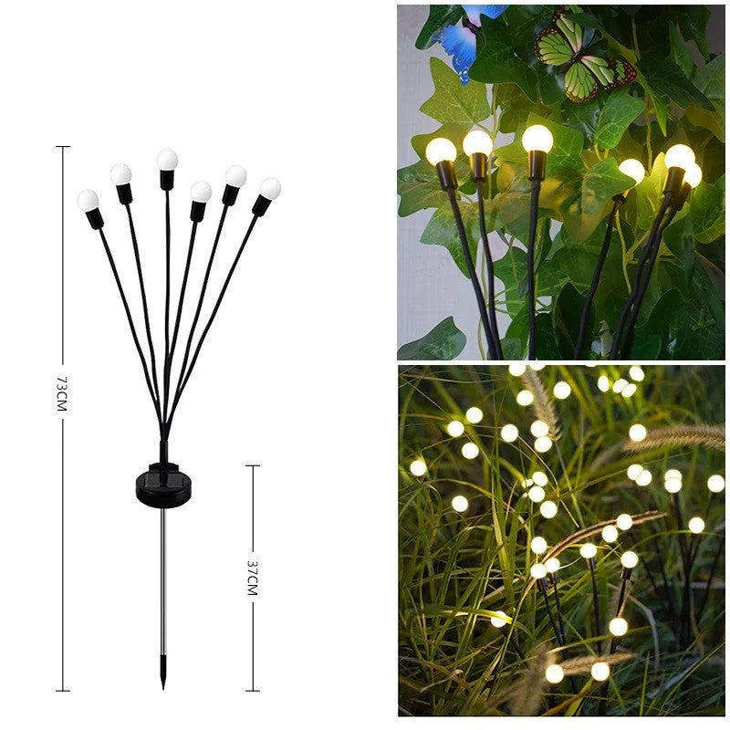 Set of solar-powered LED garden spike lights with multiple heads on stainless steel stakes for lawn or pathway.