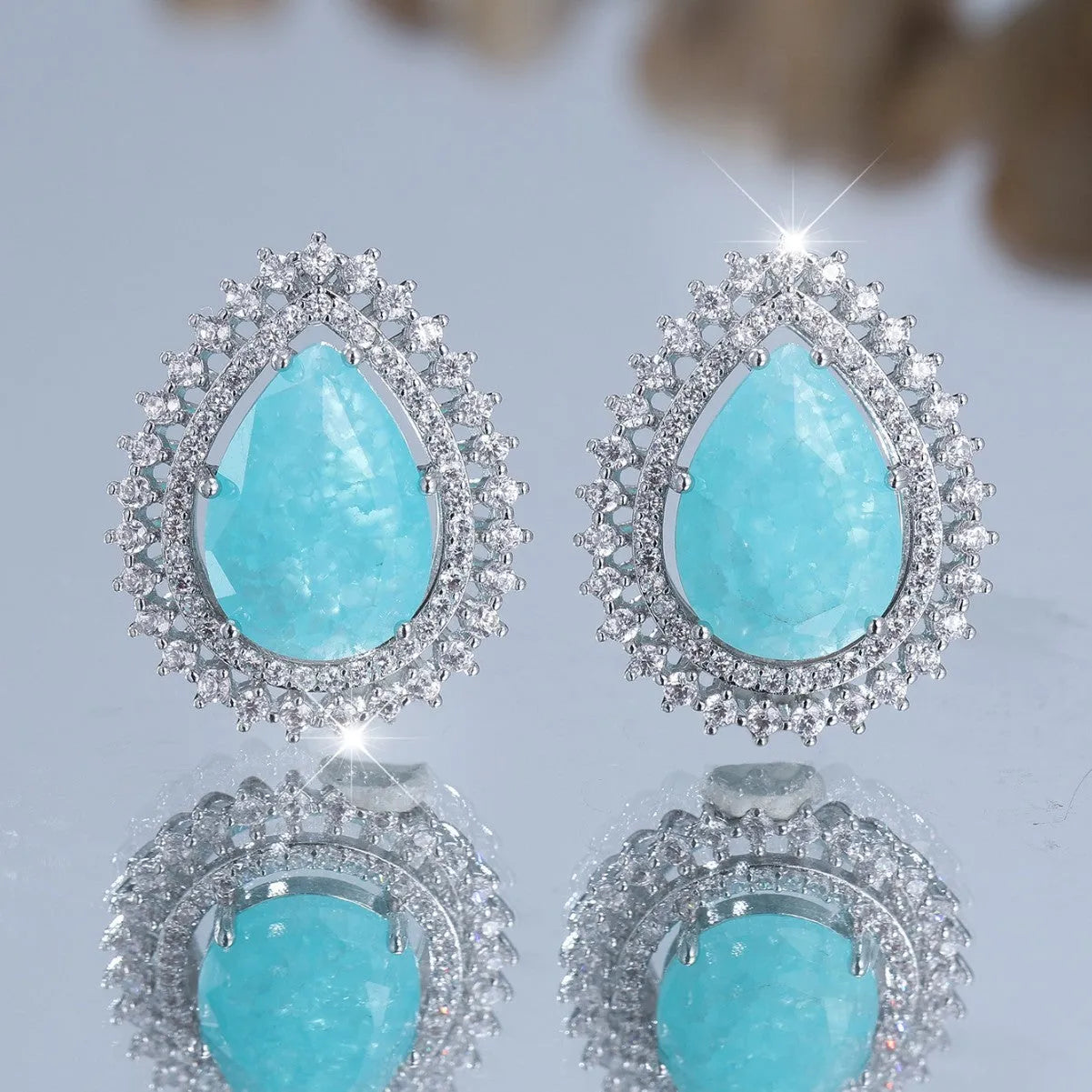 Pair of platinum ice flower diamond drop earrings with heart-shaped copper base