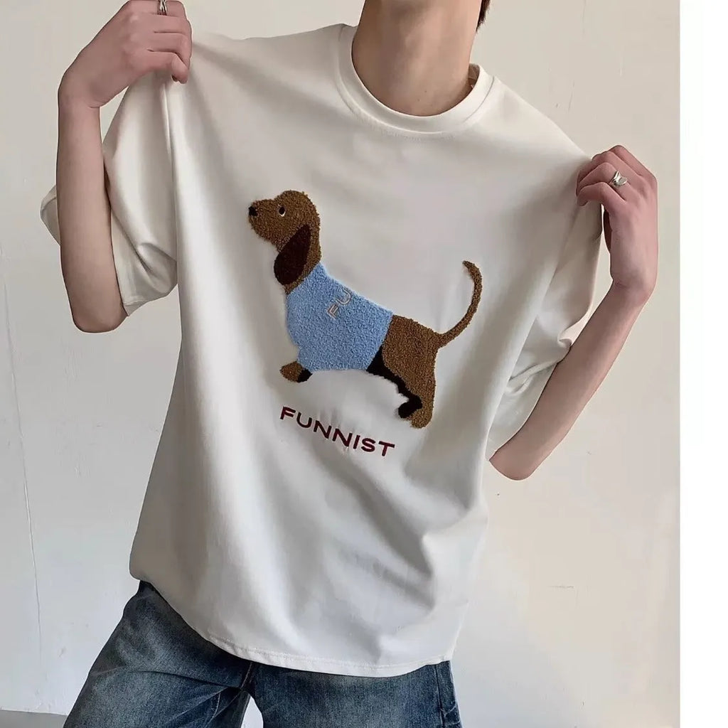 Grey men's cotton t-shirt with embroidered dachshund dog holding a towel graphic.