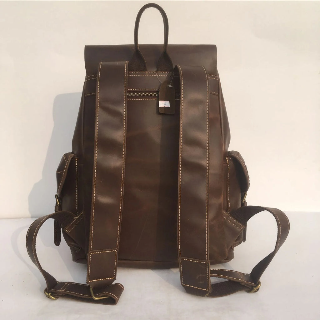 Men's genuine top layer cowhide leather backpack in coffee brown with air pillow belt, front view