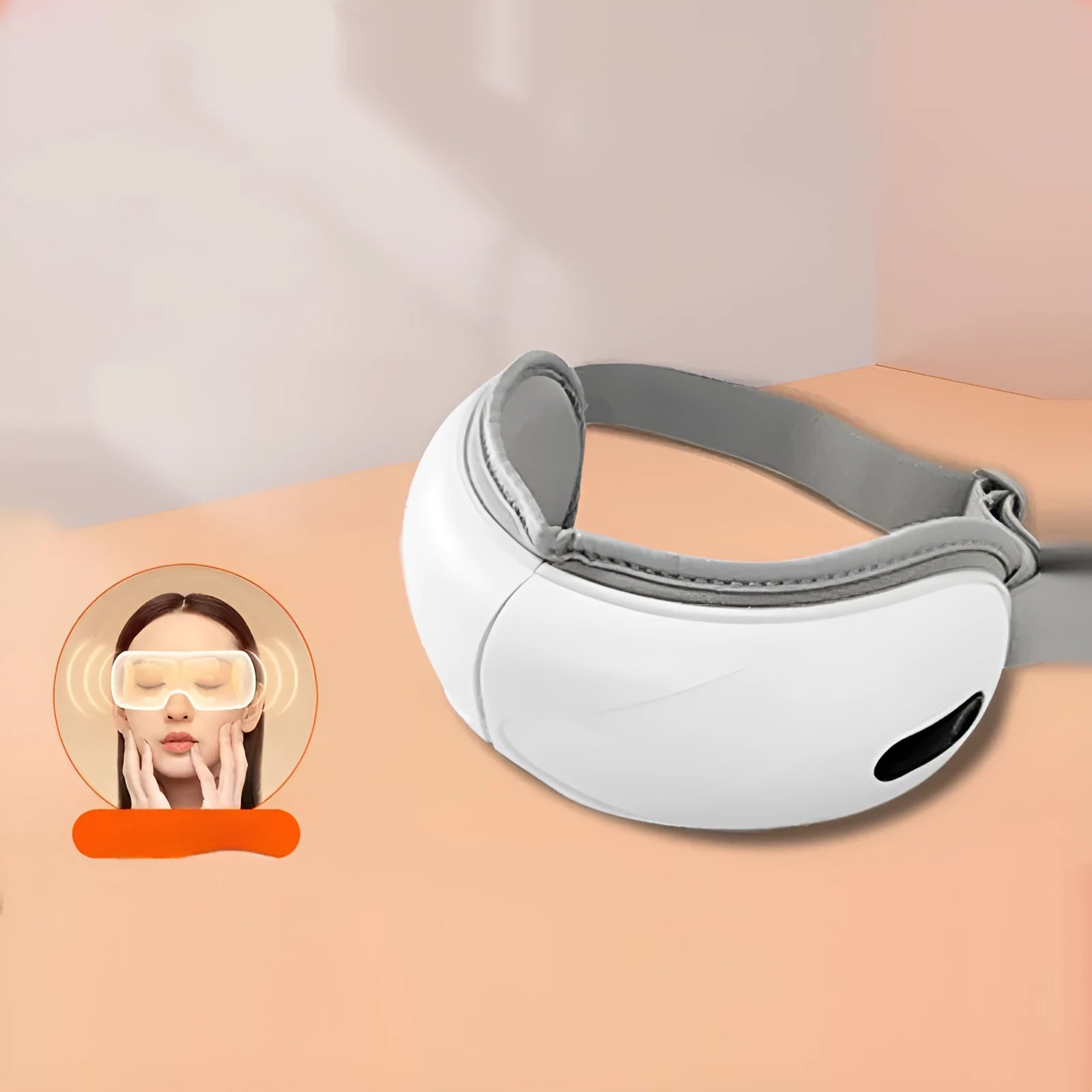 White rechargeable eye massager with hot compress function on a plain background
