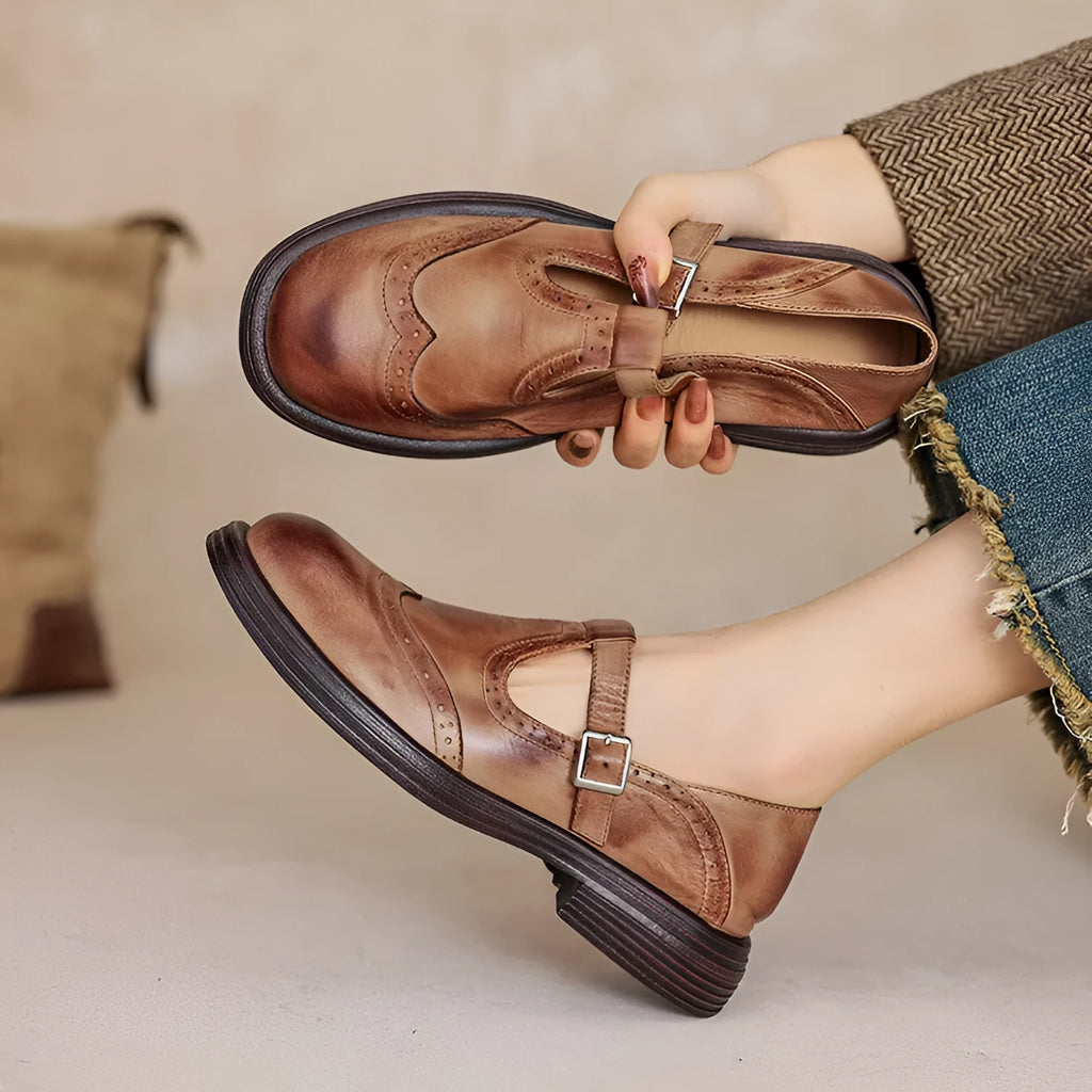 Women's flat British style sheepskin shoes in black with round toe and solid colour finish