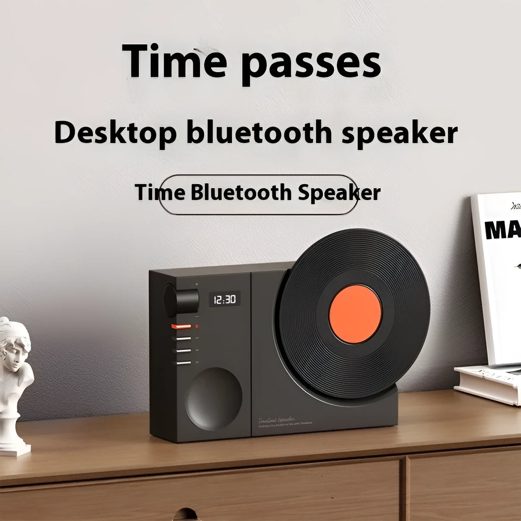 Mini portable Bluetooth speaker in coral pink colour with USB port and memory card slot.