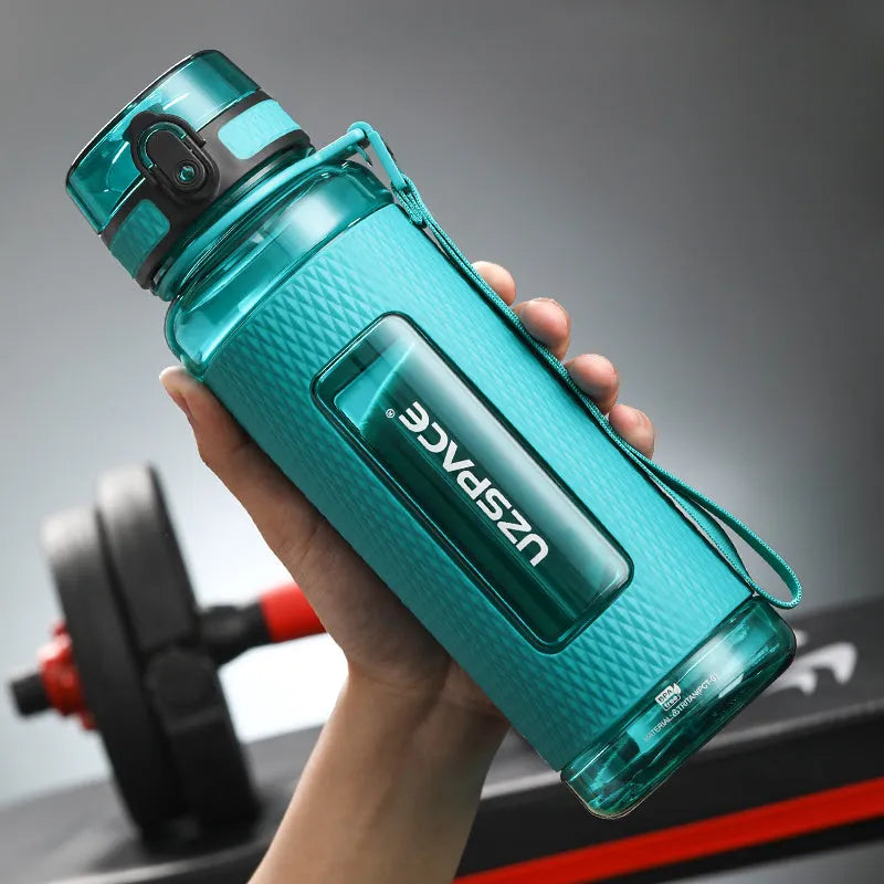 Portable sport water bottle in blue, copolymer polyester plastic, 1100ml capacity, with black cap.