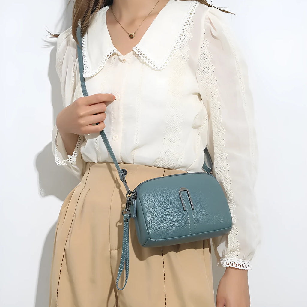 Genuine leather ladies shoulder bag in urban simplicity style, horizontal square shape, compact 19x13x6cm size.