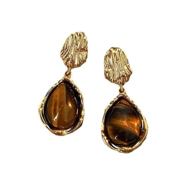 Three pairs of handmade geometric holiday earrings with tassel elements in alloy with electroplating treatment