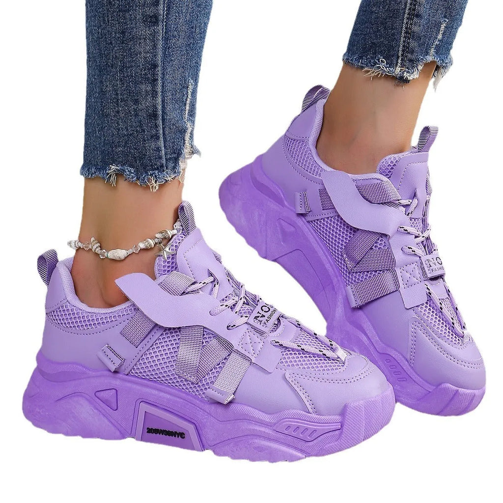 Women's purple platform mesh dad shoe with animal pattern and lace-up front on a white background.