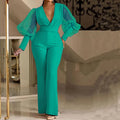 Red mesh stitch jumpsuit with long sleeves, slim torso, and wide leg trousers on a model.