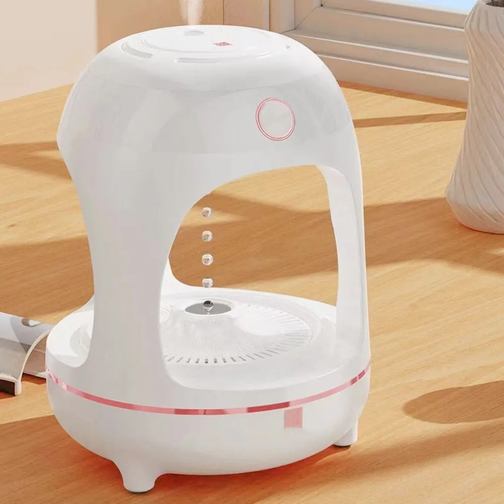 Anti gravity levitating water drops humidifier with LED night light, rose gold white, on desk
