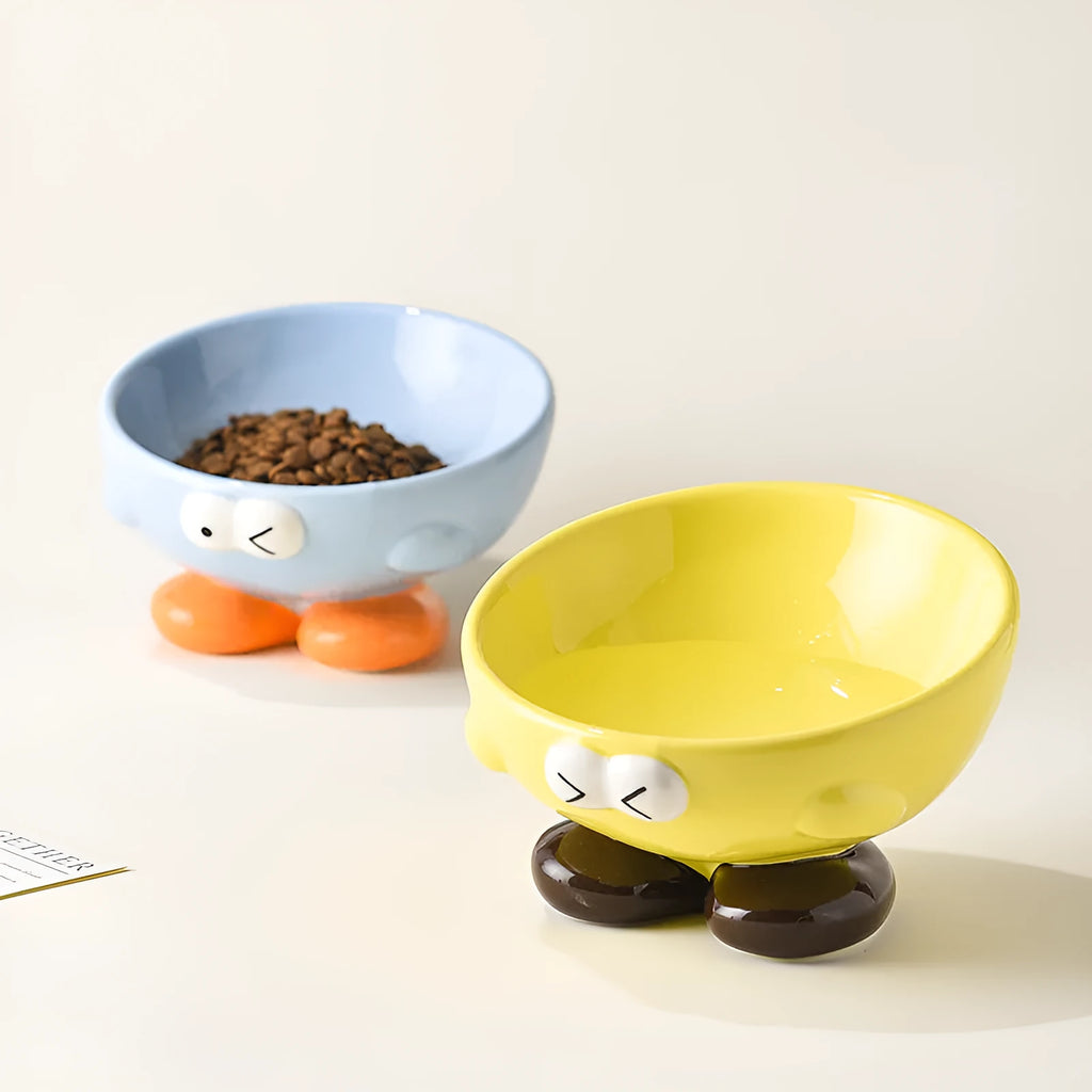 Oblique ceramic cat food bowl with cute expression print in blue for cervical spine protection