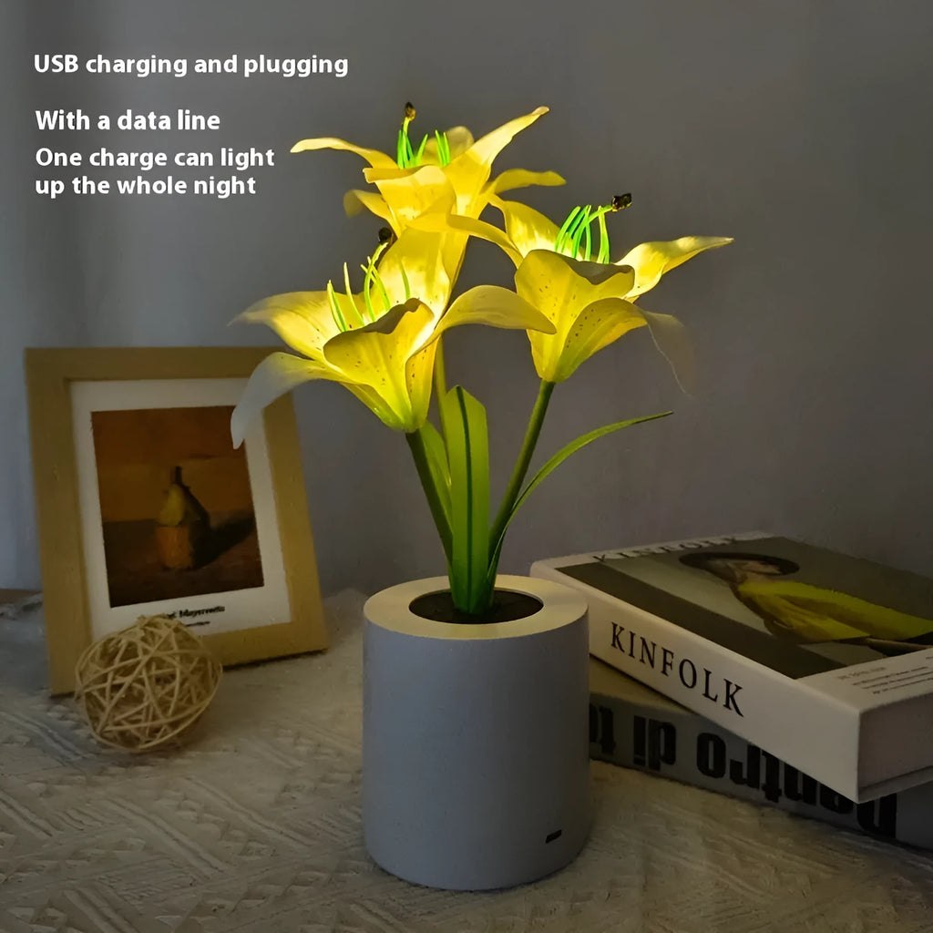 Rechargeable LED lily flower pot lamp in lily-pink colour, flower shape, on tabletop