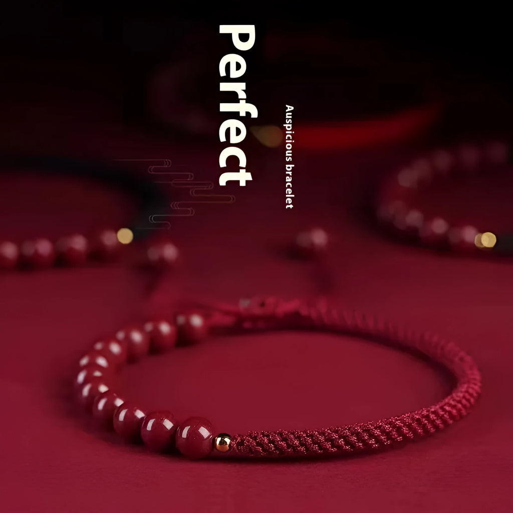 Braided rope bracelet with cinnabar beads in 8mm diameter and wine red colour