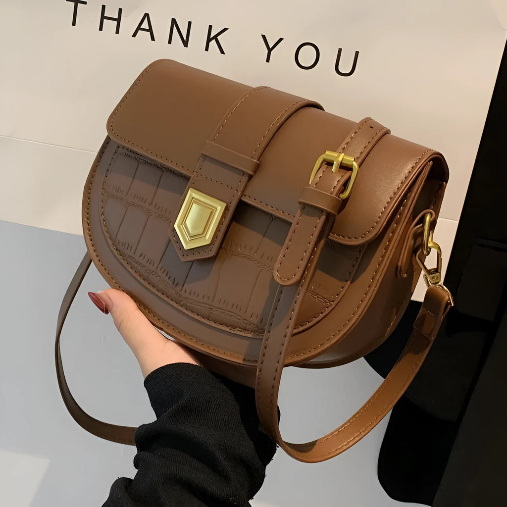 French one shoulder saddle bag in medium-soft PU with lock and stone pattern, available in black, brown, beige, and coffee