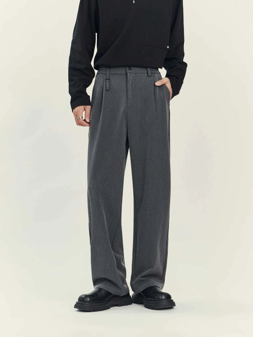 Business casual draping suit pants in black with loose straight leg and solid colour design