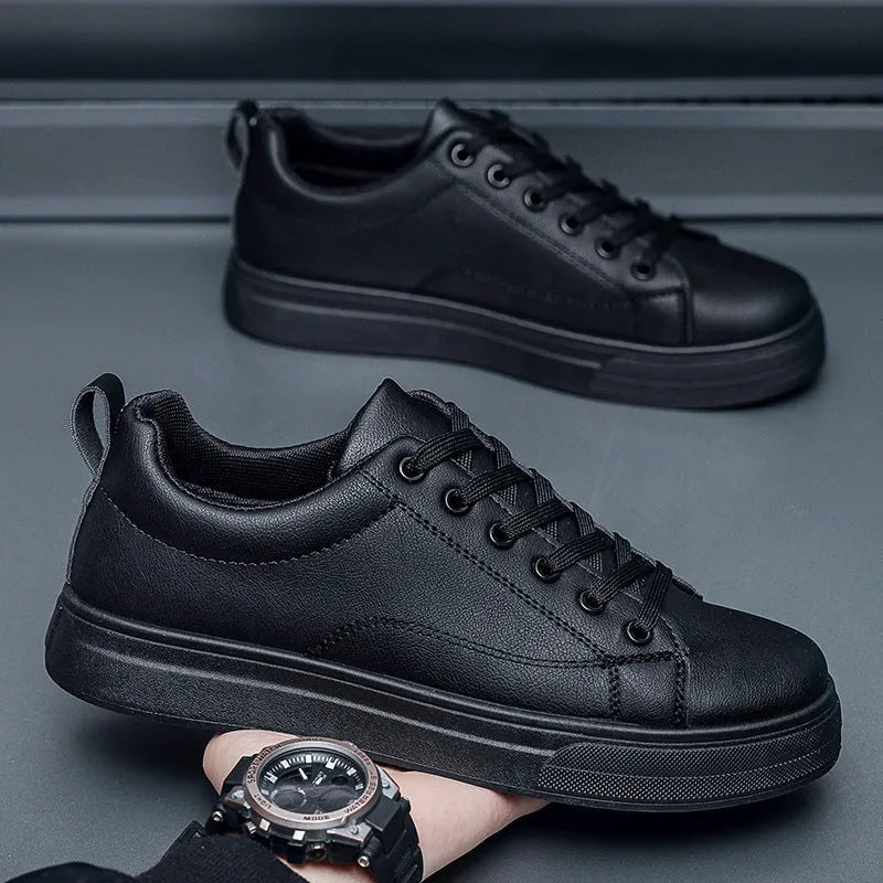 Men's low-top white and black Korean-style casual sneakers with a round toe and rubber sole.