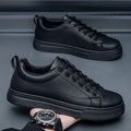 Men's low-top white and black Korean-style casual sneakers with a round toe and rubber sole.