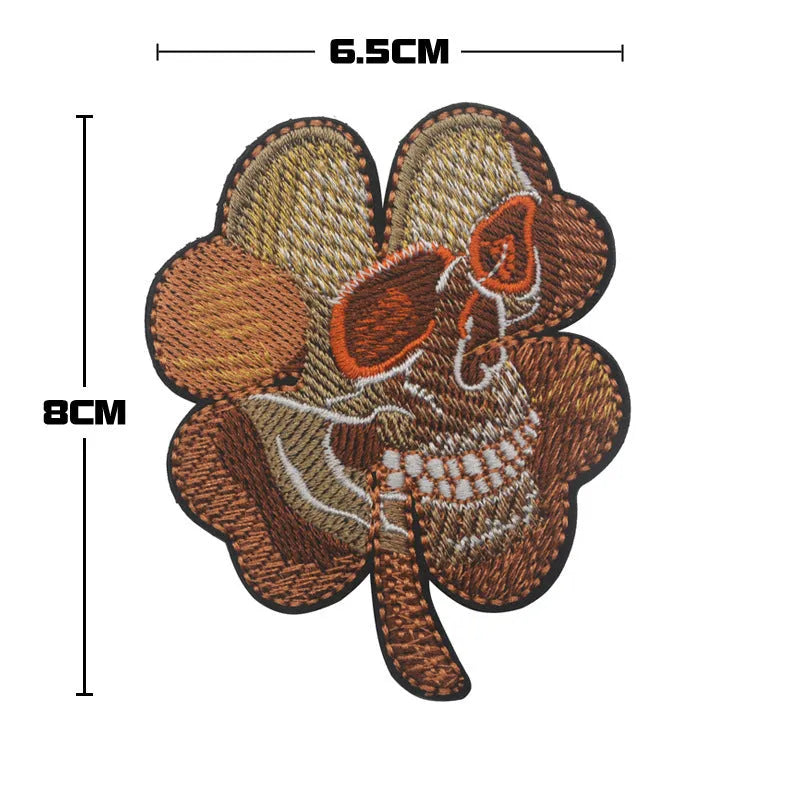 Embroidered fabric tactical badge with velcro backing showing military-inspired designs in green and black colours