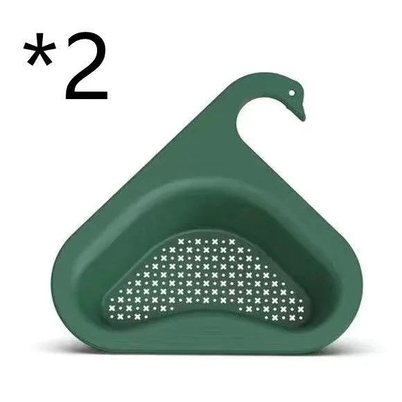 Household sink hanging fruit and vegetable drain basket in green plastic, clipped onto sink rim with slotted base