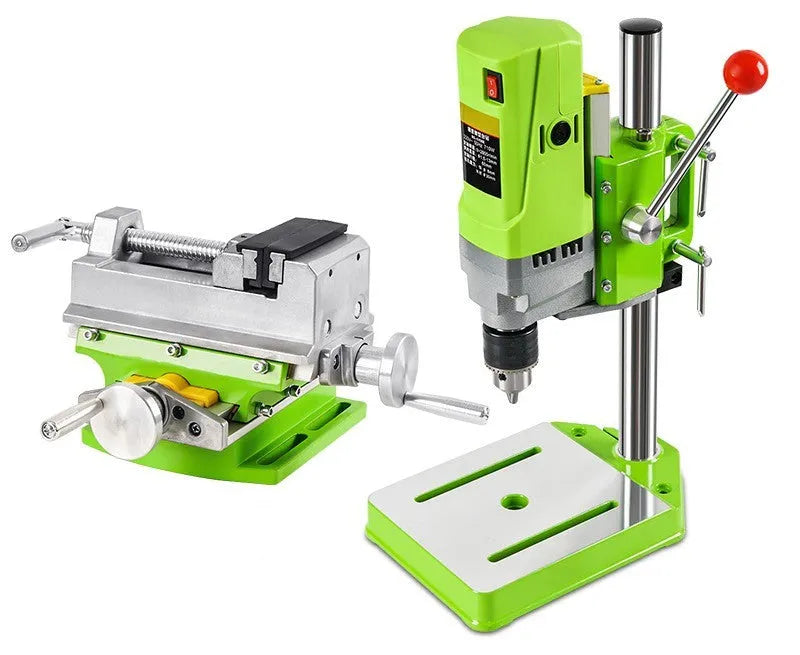 Bench drill and milling machine with cross bench pliers on workbench