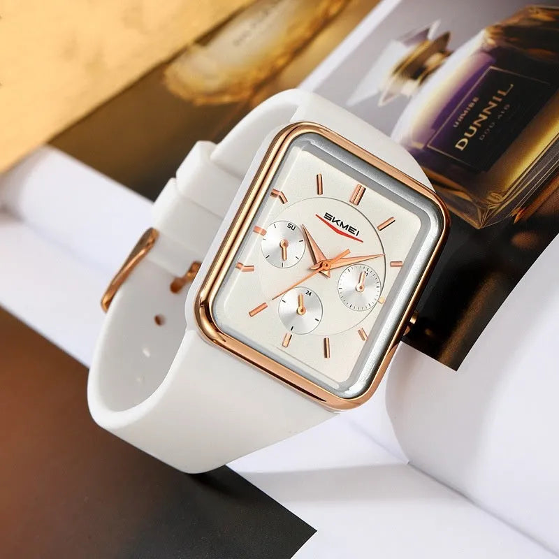 Multi functional square silicone waterproof watch for women, black gold colour, on wrist