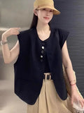 Women's loose fit polyester vest in milky white colour with pockets.
