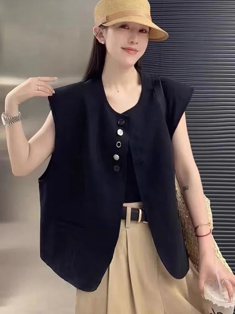 Women's loose fit polyester vest in milky white colour with pockets.