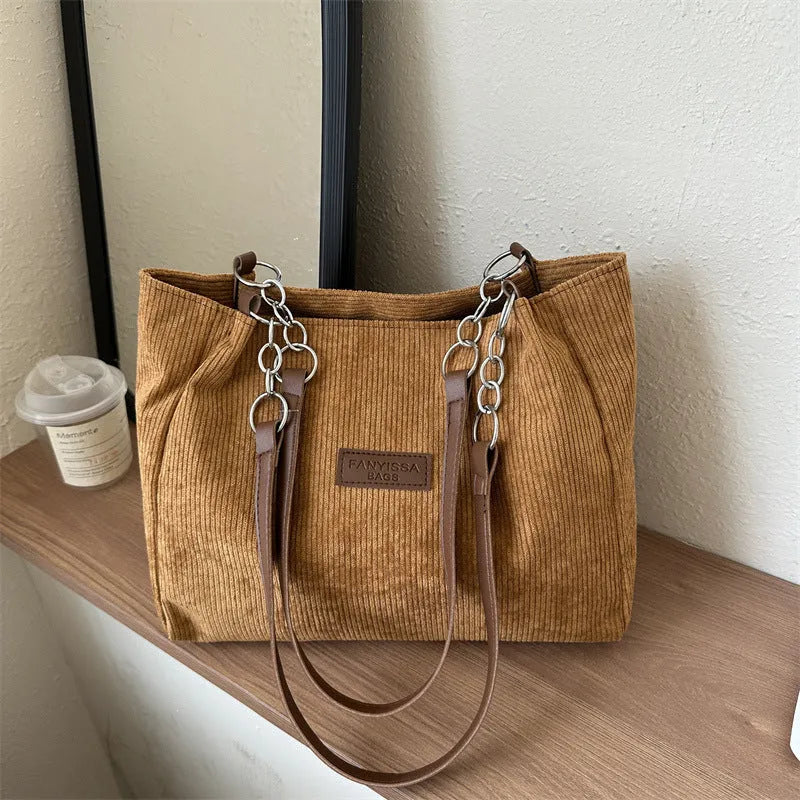 Corduroy one-shoulder tote bag in horizontal square shape with internal pockets