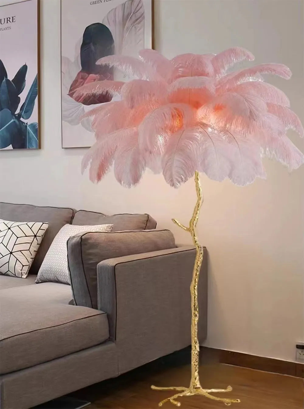 Tall white resin feather floor lamp standing in a modern living room.