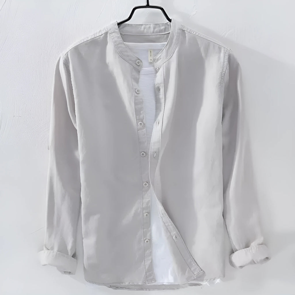 Man's loose-fit long sleeve casual shirt in linen-cotton blend, shown in dark blue colour.